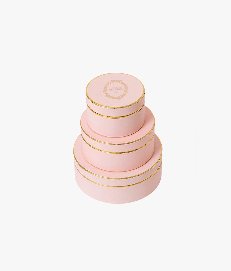 Almonds coated in a crunchy sugar shell, presented in an elegant pink box.