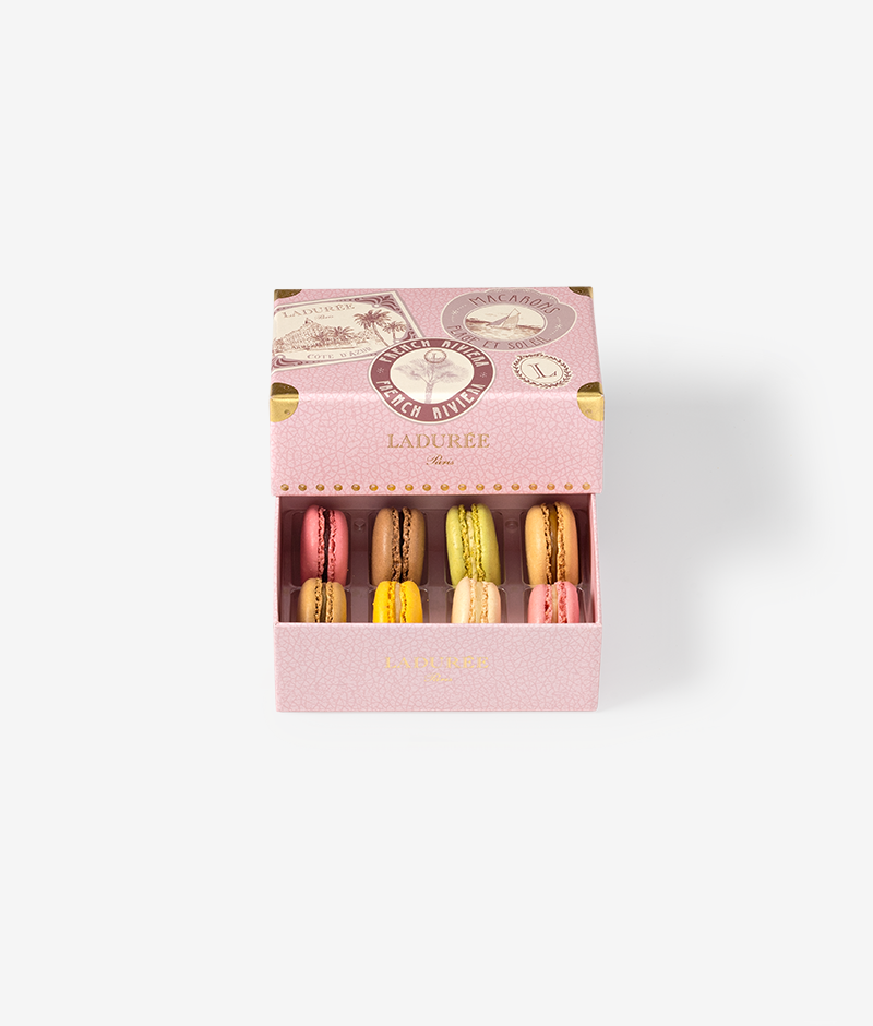 Ladurée presents a new collection designed as an invitation to travel. Destination sun, sweet life and macarons, with the French Riviera box celebrating the Côte d'Azur, its landscapes and beaches.